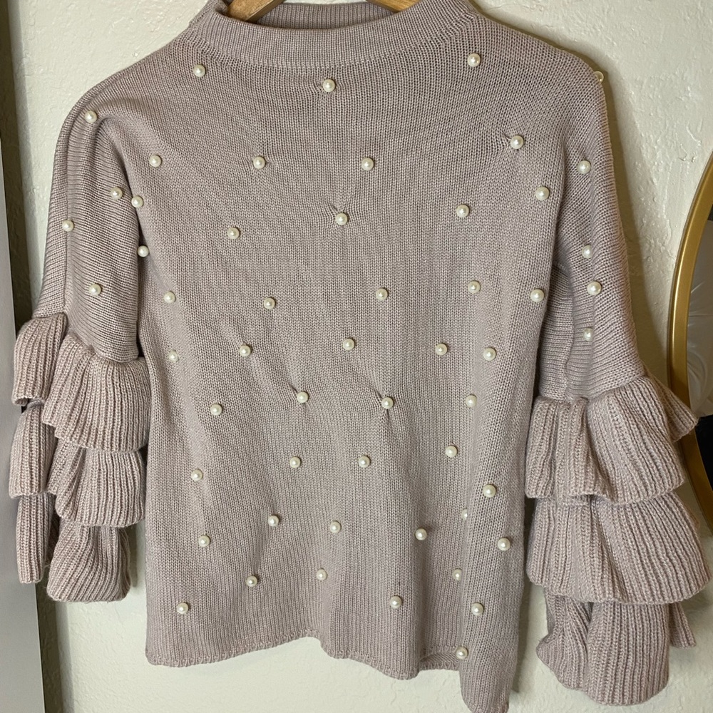 It is size S, it was only used once it's a low pink color